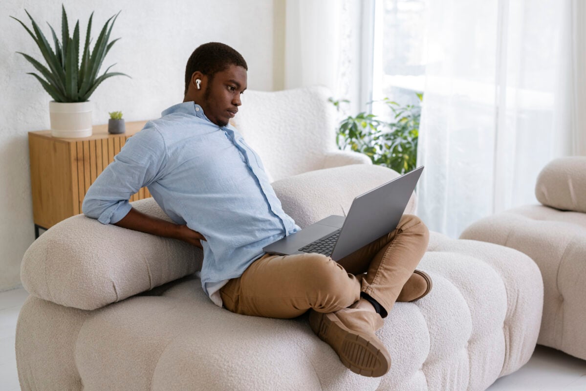 Modern grey sofa set with plush cushions in a stylish living room, available for purchase online in Kenya