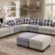 Cream and blue corner sectional sofa with matching ottomans in a modern living room