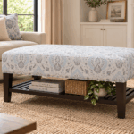 Torrent ottoman with patterned upholstered top, dark wooden frame and lower storage shelf
