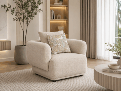 Alto single sofa in beige with rounded arms and decorative cushions
