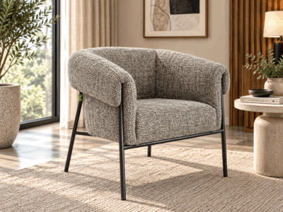 Elara grey textured upholstered accent chair with curved arms and black metal frame