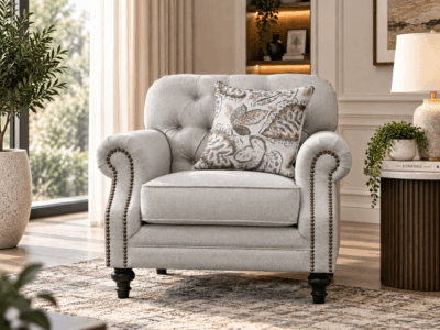 Keensburg single sofa in light beige fabric with button tufted back, rolled arms and nailhead detailing