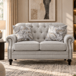 Keensburg 2 seater sofa in light beige fabric with button tufted back and rolled arms