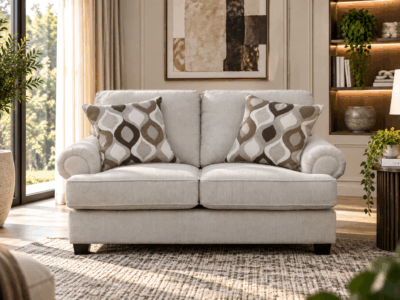 Nettington 2 seater beige fabric sofa with plush cushions and rounded arms
