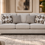 Nettington 3 seater beige fabric sofa with plush cushions and patterned accent pillows