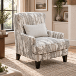 Polar accent chair with grey and white patterned upholstery, lumbar cushion and dark wooden legs