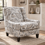 Solar accent chair with floral patterned upholstery, cushioned seat and dark wooden legs