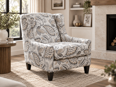 Solar accent chair with floral patterned upholstery, cushioned seat and dark wooden legs