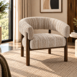 Solara accent chair with curved beige textured upholstery and warm wooden frame