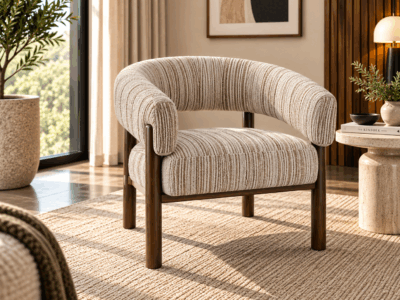 Solara accent chair with curved beige textured upholstery and warm wooden frame