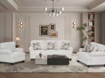 Niki 6 seater grey fabric sofa set with a three-seater sofa and two armchairs in an elegant living room.