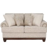 New Belmont 2 seater beige fabric sofa with rolled armrests, decorative stud detailing and wooden feet.