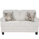 Niki 2 seater grey fabric sofa with plush cushions and contemporary styling.